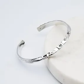 KNIFE EDGE WITH STAMPED FEATHER SIDES, CENTER SUNS