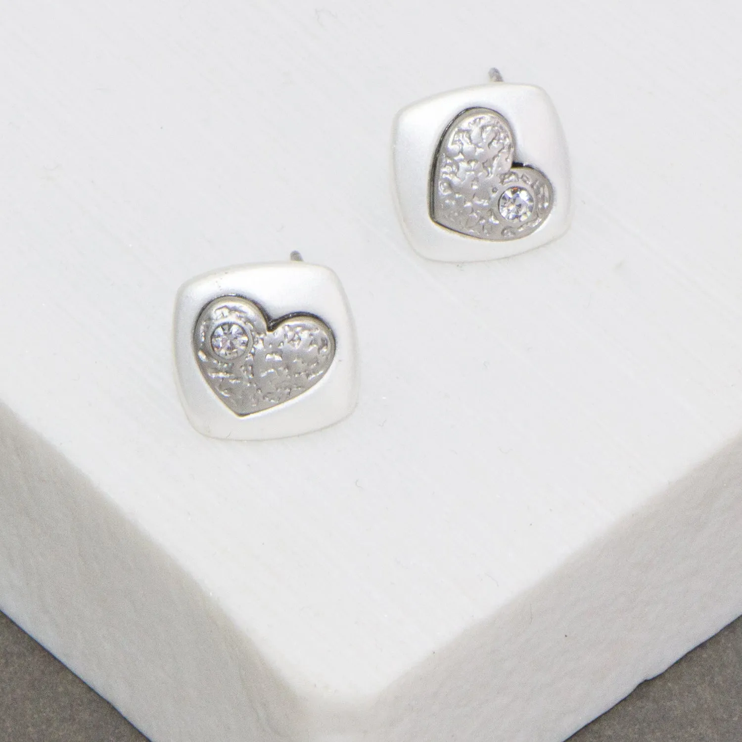 Two tone relief heart on square base earrings